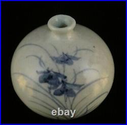 Korean blue and white vase. Flower motif, artist signed. 4 3/4 t