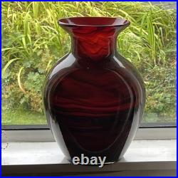 Large cased studio glass vase in rich Ruby Red with a dark Swirl pattern