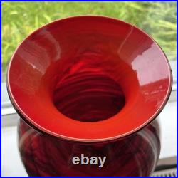 Large cased studio glass vase in rich Ruby Red with a dark Swirl pattern
