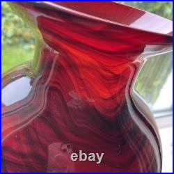 Large cased studio glass vase in rich Ruby Red with a dark Swirl pattern