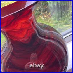 Large cased studio glass vase in rich Ruby Red with a dark Swirl pattern