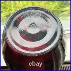 Large cased studio glass vase in rich Ruby Red with a dark Swirl pattern