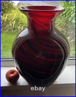 Large cased studio glass vase in rich Ruby Red with a dark Swirl pattern